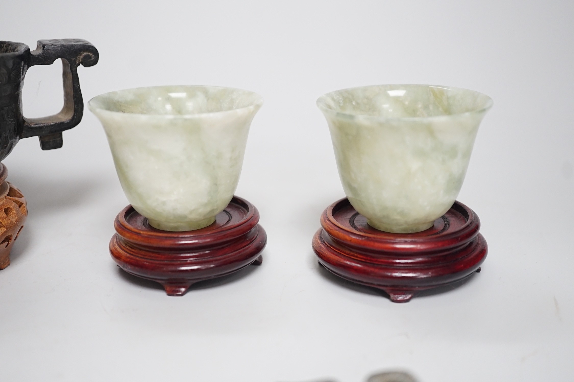 A selection of five Chinese archaistic hardstone carvings. Tallest 8cm including stand
